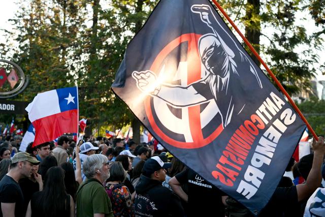 Supporters of Chile's presidential candidate Johannes Kaiser of the Libertarian National Party attend his closing campaign rally in Santiago on November 12, 2025. (Photo by Marvin RECINOS / AFP)