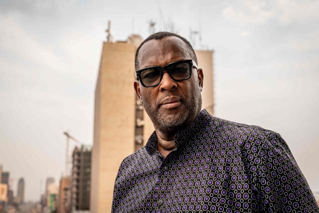 Nzanga Mobutu, son of former President Mobutu Sese Seko, poses for a portrait in Kinshasa, on October 20, 2025. Almost thirty years after the fall of Mobutu Sese Seko, an exhibition dedicated to the former president of Zaire (now the Democratic Republic of Congo, DRC) is generating keen interest among young Congolese born after 1997. Entitled ‘Mobutu, a life, a destiny’, the exhibition, organised by the family of the former president of the Republic, presents personal items, photographs and other archival documents. (Photo by Glody MURHABAZI / AFP)