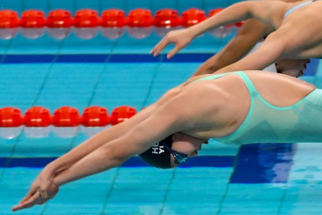 China's Yu Zidi competes in the women's 200 metre individual medley during the National Games of China in Shenzhen on November 11, 2025. Chinese swimming prodigy Yu Zidi sent shockwaves through the swimming world again with a blistering Asian record time at China's National Games in Shenzhen. Yu, who turned 13 in October, swam an impressive 2:07:41 to claim gold in the women's 200 metre individual medley on November 11. (Photo by AFP) / China OUT