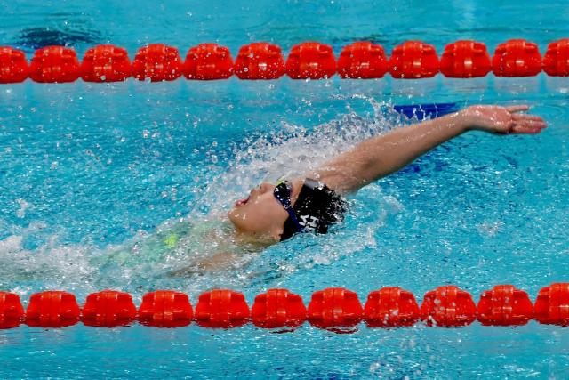 China's Yu Zidi competes in the women's 200 metre individual medley during the National Games of China in Shenzhen on November 11, 2025. Chinese swimming prodigy Yu Zidi sent shockwaves through the swimming world again with a blistering Asian record time at China's National Games in Shenzhen. Yu, who turned 13 in October, swam an impressive 2:07:41 to claim gold in the women's 200 metre individual medley on November 11. (Photo by AFP) / China OUT