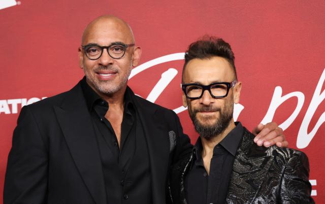 CEO of The Recording Academy Harvey Mason Jr. (L) and President of The Recording Academy Panos Panay (R) attend the Latin Recording Academy Person of the Year gala at the Mandalay Bay South Convention Center in Las Vegas, Nevada on November 12, 2025. The 2025 Latin Recording Academy Person of the Year honour has been awarded to Spanish singer Raphael. (Photo by Michael Tran / AFP)