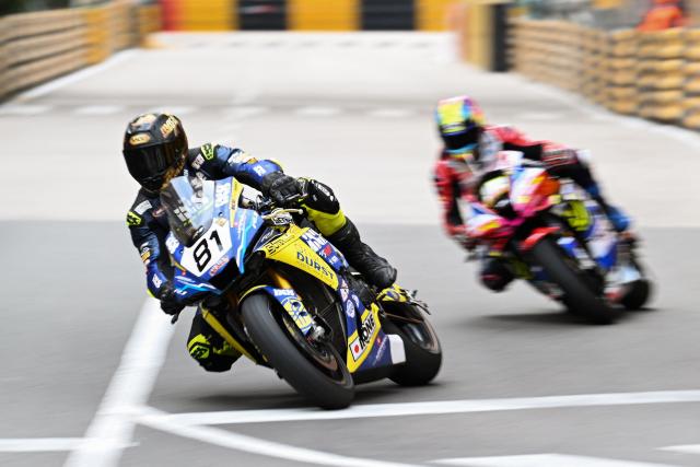 Hoffmann and LM by MRP's Swiss rider Lukas Randy Maurer (L) rides during the MotoGP first practice session of the 57th Macau Motorcycle Grand Prix at the Guia Circuit in Macau on November 13, 2025. (Photo by Peter PARKS / AFP)