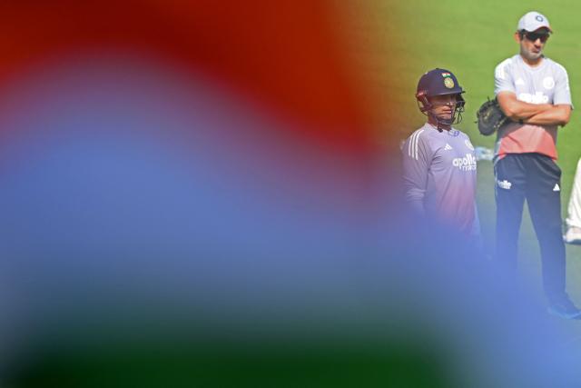 India’s captain Shubman Gill (L) and head coach Gautam Gambhir gesture during a practice session on the eve of their first Test cricket match against South Africa, at the Eden Gardens in Kolkata on November 13, 2025. (Photo by DIBYANGSHU SARKAR / AFP)