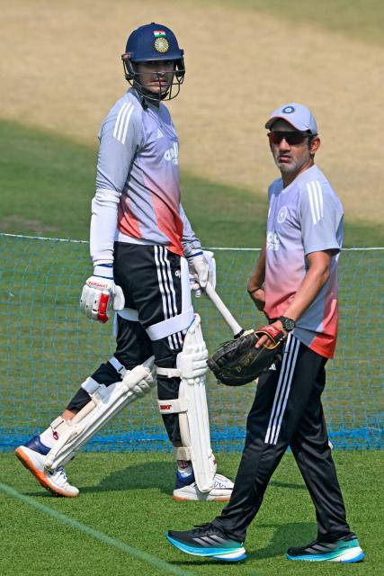 India’s captain Shubman Gill (L) and head coach Gautam Gambhir gesture during a practice session on the eve of their first Test cricket match against South Africa, at the Eden Gardens in Kolkata on November 13, 2025. (Photo by DIBYANGSHU SARKAR / AFP)