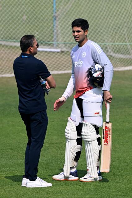 India’s captain Shubman Gill and Board of Control for Cricket in India (BCCI) selection committee chairman Ajit Agarkar interact during a practice session on the eve of their first Test cricket match against South Africa, at the Eden Gardens in Kolkata on November 13, 2025. (Photo by DIBYANGSHU SARKAR / AFP)