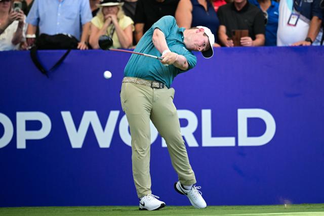 TOPSHOT - Scotland's Robert MacIntyre tees off at the first hole on day one of the DP World Tour Championship 2025 golf tournament at Jumeirah Golf Estates in Dubai on November 13, 2025. (Photo by Giuseppe CACACE / AFP)