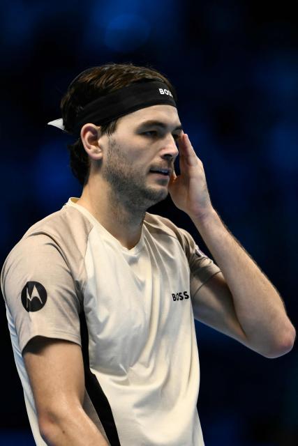 USA's Taylor Fritz reacts during his match against Australia's Alex De Minaur at the ATP Finals tennis tournament in Turin on November 13, 2025. (Photo by Marco BERTORELLO / AFP)