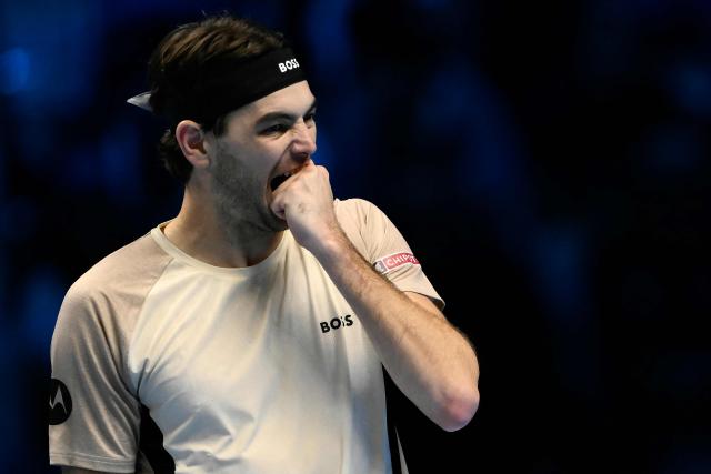 USA's Taylor Fritz reacts during his match against Australia's Alex De Minaur at the ATP Finals tennis tournament in Turin on November 13, 2025. (Photo by Marco BERTORELLO / AFP)