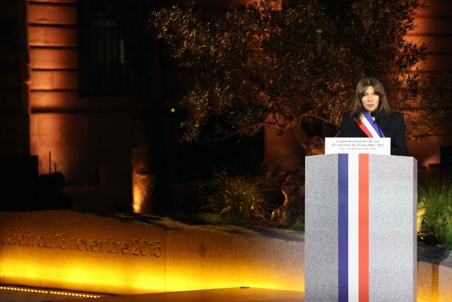 Paris' mayor Anne Hidalgo delivers a speech during a ceremony marking a decade since the terror attacks of November 13, 2015 in which 130 civilians were killed, at the "Jardin du 13 novembre 2015" in Paris on November 13, 2025. (Photo by Ludovic MARIN / POOL / AFP)