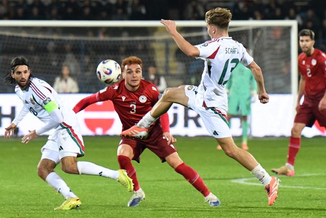 Hungary's midfielder #10 Dominik Szoboszlai, Armenia's defender #03 Erik Piloyan and Hungary's midfielder #13 Andras Schafer vie for the ball during the FIFA World Cup 2026 qualifiers Europe zone group F football match between Armenia and Hungary at the Republican Stadium after Vazgen Sargsyan in Yerevan on November 13, 2025. (Photo by KAREN MINASYAN / AFP)