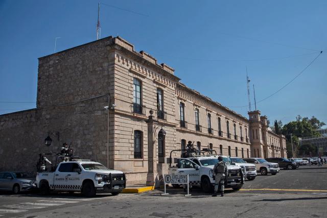Military forces provide security during a meeting about the Michoacan Plan for Peace and Justice, at the facilities of the Morelos barracks in the XXI Military Zone in Morelia, Micoacan, Mexico, on November 13, 2025. Mexican Secretary of Security and Citizen Protection, Omar Garcia Harfuch, Mexican Secretary of Defense Ricardo, Trevilla, the head of the office of the Mexican Presidency, Lazaro Cardenas Batel, and the governor of Michoacan, Alfredo Ramirez Bedolla, met Thursday. (Photo by Carl DE SOUZA and ENRIQUE CASTRO / AFP)
