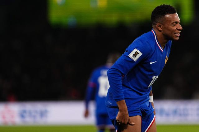 France's forward #10 Kylian Mbappe reacts during the 2026 World Cup qualifiers Europe zone group D football match between France and Ukraine at the Parc des Princes stadium in Paris, on November 13, 2025. (Photo by Dimitar DILKOFF / AFP)
