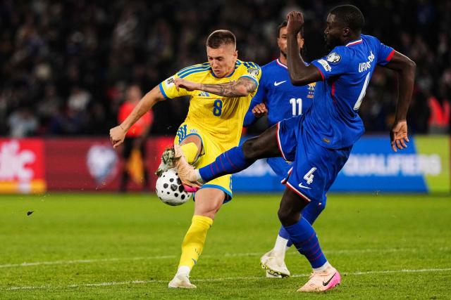 Ukraine's midfielder #08 Yehor Nazaryna (L) fights for the ball with France's defender #04 Dayot Upamecano during the 2026 World Cup qualifiers Europe zone group D football match between France and Ukraine at the Parc des Princes stadium in Paris, on November 13, 2025. (Photo by Dimitar DILKOFF / AFP)