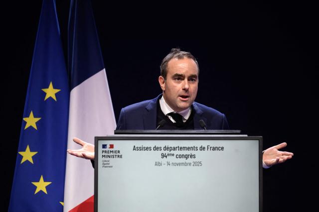 France's Prime Minister Sebastien Lecornu gestures as he addresses the audience during the closing of the 94th edition of the Assises Nationales des Departements de France (National Assembly of France's Departments) at the exhibition center in Albi, southern France on November 14, 2025. (Photo by Ed JONES / AFP)