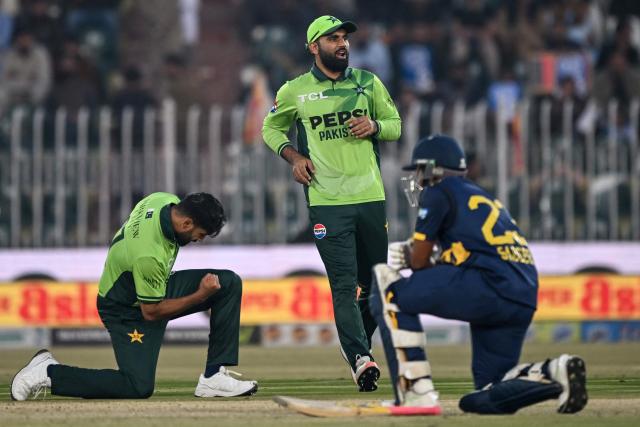 Pakistan's Haris Rauf (L) celebrates after taking the wicket of Sri Lanka's Sadeera Samarawickrama (R) during the second one-day international (ODI) cricket match between Pakistan and Sri Lanka at the Rawalpindi Cricket Stadium in Rawalpindi on November 14, 2025. (Photo by Farooq NAEEM / AFP)
