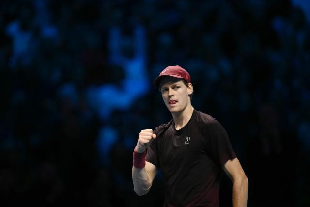 Italy's Jannik Sinner celebrates after winning his match against USA's Ben Shelton at the ATP Finals tennis tournament in Turin on November 14, 2025. (Photo by Marco BERTORELLO / AFP)