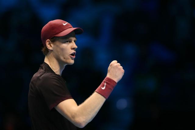 Italy's Jannik Sinner celebrates after winning his match against USA's Ben Shelton at the ATP Finals tennis tournament in Turin on November 14, 2025. (Photo by Marco BERTORELLO / AFP)