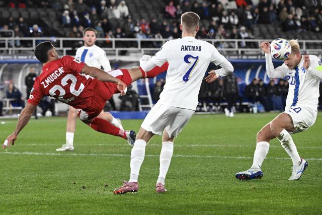 Malta's defender #22 Zach Muscat (L) tries to stop Finland's forward #19 Benjamin Kallman (background), Finland's forward #07 Oliver Antman (C) and Finland's forward #20 Joel Pohjanpalo (R) vie for the ball during the 1st round - day 9 - Group G World Cup 2026 European Qualifiers football match between Finland and Malta on November 14, 2025 in Helsinki, Finland. (Photo by Heikki Saukkomaa / Lehtikuva / AFP) / Finland OUT