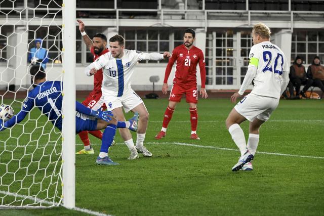 Malta's goalkeeper #01 Henry Bonello (L) tries to stop Finland's forward #19 Benjamin Kallman (C) and Finland's forward #20 Joel Pohjanpalo (R) during the 1st round - day 9 - Group G World Cup 2026 European Qualifiers football match between Finland and Malta on November 14, 2025 in Helsinki, Finland. (Photo by Heikki Saukkomaa / Lehtikuva / AFP) / Finland OUT