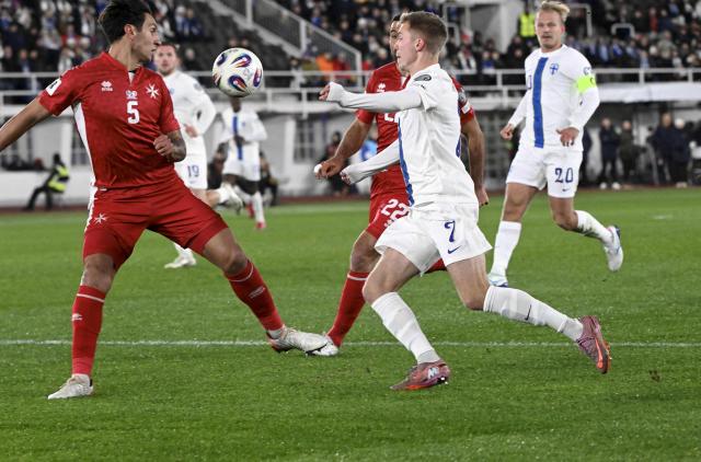 Malta's defender #05 Kurt Shaw (L) and Malta's defender #22 Zach Muscat (2nd L) try to stop Finland's forward #07 Oliver Antman (2nd R) and Finland's forward #20 Joel Pohjanpalo (R) during the 1st round - day 9 - Group G World Cup 2026 European Qualifiers football match between Finland and Malta on November 14, 2025 in Helsinki, Finland. (Photo by Heikki Saukkomaa / Lehtikuva / AFP) / Finland OUT