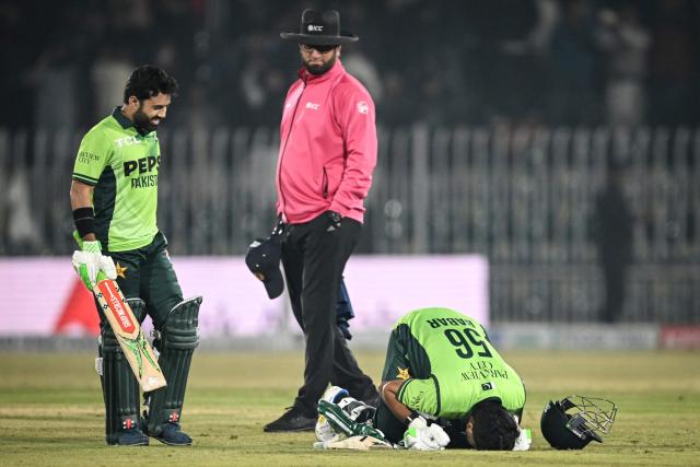 Pakistan's Babar Azam celebrates after scoring a century during the second one-day international (ODI) cricket match between Pakistan and Sri Lanka at the Rawalpindi Cricket Stadium in Rawalpindi on November 14, 2025. (Photo by Farooq NAEEM / AFP)