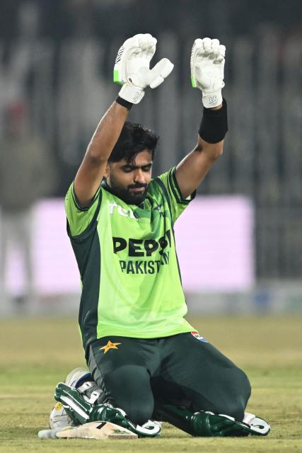 Pakistan's Babar Azam celebrates after scoring a century during the second one-day international (ODI) cricket match between Pakistan and Sri Lanka at the Rawalpindi Cricket Stadium in Rawalpindi on November 14, 2025. (Photo by Farooq NAEEM / AFP)