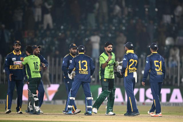 Pakistan's Babar Azam (3rd R) and Mohammad Rizwan (3rd L) greet Sri Lanka's cricketers after winning the second one-day international (ODI) cricket match between Pakistan and Sri Lanka at the Rawalpindi Cricket Stadium in Rawalpindi on November 14, 2025. (Photo by Farooq NAEEM / AFP)