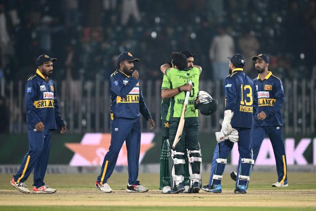 Pakistan's Babar Azam (3rd L) and Mohammad Rizwan (3rd R) celebrate after winning the second one-day international (ODI) cricket match between Pakistan and Sri Lanka at the Rawalpindi Cricket Stadium in Rawalpindi on November 14, 2025. (Photo by Farooq NAEEM / AFP)