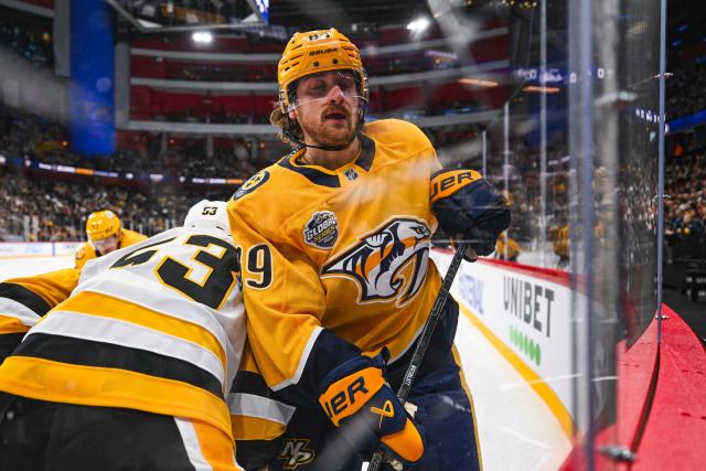 Nashville Predators' forward #89 Ozzy Wiesblatt (R) vies for the puck with Pittsburgh Penguins' forward #53 Philip Tomasino during the NHL Global Series Sweden ice hockey match between Pittsburgh Penguins and Nashville Predators at Avicii Arena in Stockholm, Sweden, on November 14, 2024. (Photo by Jonathan NACKSTRAND / AFP)