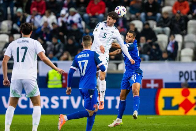 Slovakia's defender #16 David Hancko (R) and Northern Ireland's defender #05 Trai Hume (2nd R) vie for the ball during the 1st round - Group A World Cup 2026 European Qualifiers football match between Slovakia and Northern Ireland on November 14, 2025 in Kosice, Slovakia. (Photo by Branislav Racko / AFP)