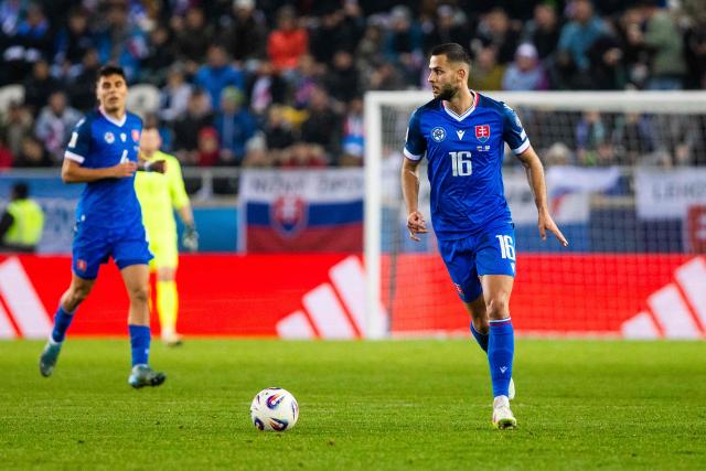 Slovakia's defender #16 David Hancko (R) controls the ball during the 1st round - Group A World Cup 2026 European Qualifiers football match between Slovakia and Northern Ireland on November 14, 2025 in Kosice, Slovakia. (Photo by Branislav Racko / AFP)