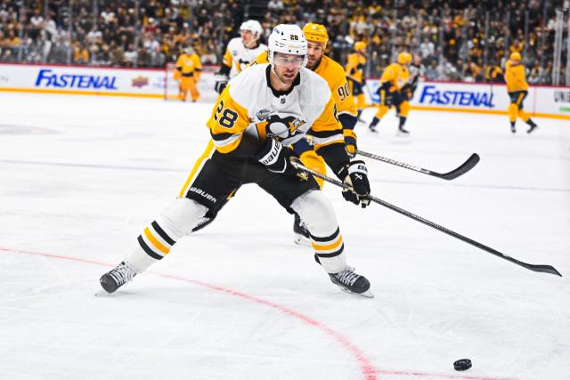 Pittsburgh Penguins' defender #28 Parker Wotherspoon vies for the puck during the NHL Global Series Sweden ice hockey match between Pittsburgh Penguins and Nashville Predators at Avicii Arena in Stockholm, Sweden, on November 14, 2024. (Photo by Jonathan NACKSTRAND / AFP)