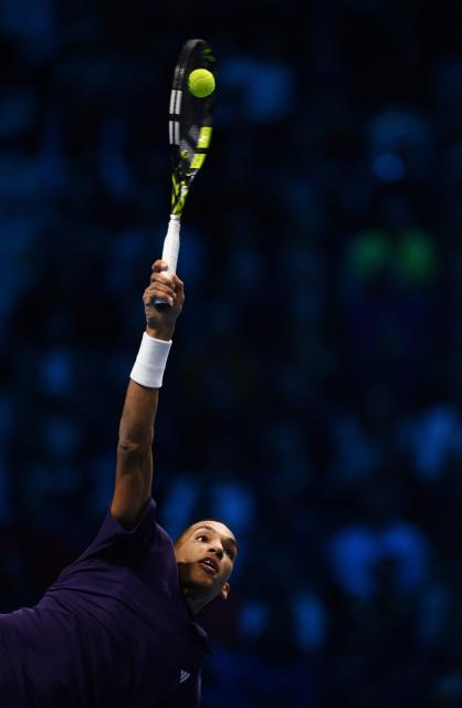 Canada’s Felix Auger Aliassime serves to Germany’s Alexander Zverev during their men's single tennis match at the ATP Finals tennis tournament, in Turin, on November 14, 2025. (Photo by MARCO BERTORELLO / AFP)