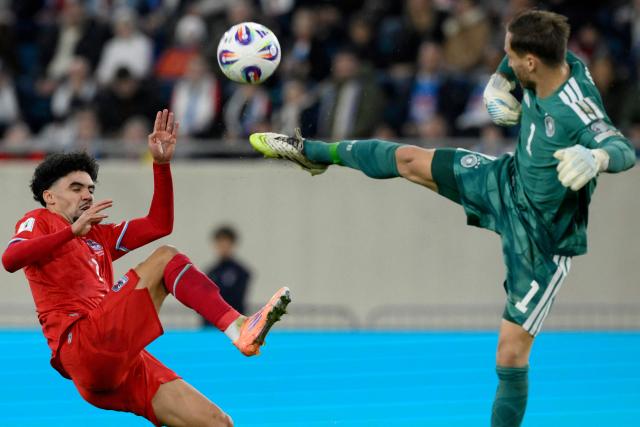 Luxembourg's forward #07 Aiman Dardari (L) fights for the ball with Germany's goalkeeper #01 Oliver Baumann during the 2026 World Cup qualifiers Europe zone group A football match between Luxembourg and Germany at the Luxembourg Stadium in Luxembourg on November 14, 2025. (Photo by JOHN THYS / AFP)