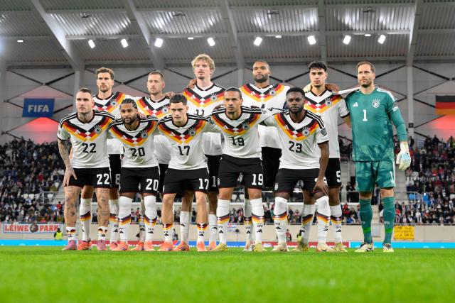 Germany's players pose for a group photo prior to the 2026 World Cup qualifiers Europe zone group A football match between Luxembourg and Germany at the Luxembourg Stadium in Luxembourg on November 14, 2025. (Photo by JOHN THYS / AFP)