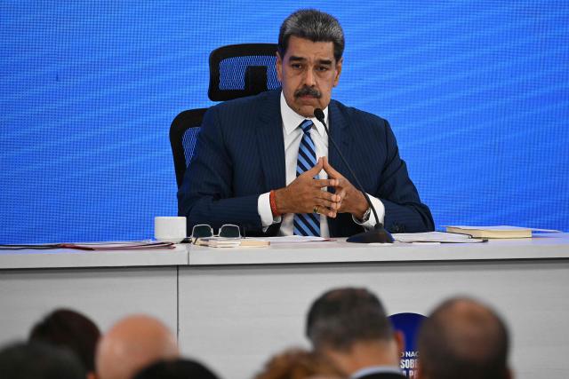 Venezuela's President Nicolas Maduro looks on during the Meeting of Jurists in Defense of International Law at the Eurobuilding Hotel in Caracas on November 14, 2025. (Photo by Federico PARRA / AFP)
