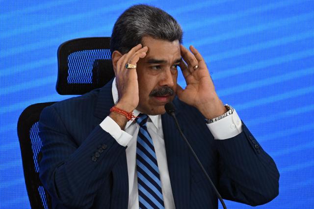 Venezuela's President Nicolas Maduro gestures during the Meeting of Jurists in Defense of International Law at the Eurobuilding Hotel in Caracas on November 14, 2025. (Photo by Federico PARRA / AFP)