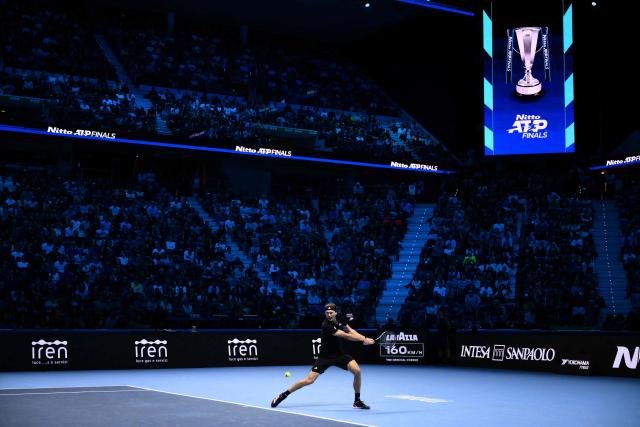 Germany’s Alexander Zverev plays a backhand return against Canada’s Felix Auger Aliassime during their men's single tennis match at the ATP Finals tennis tournament, in Turin, on November 14, 2025. (Photo by MARCO BERTORELLO / AFP)