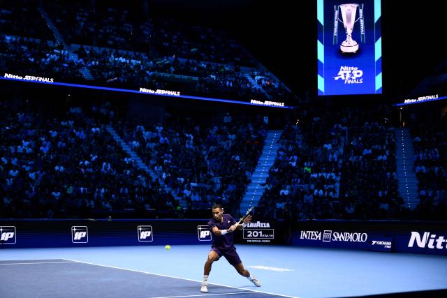 Canada’s Felix Auger Aliassime plays a backhand return against Germany’s Alexander Zverev during their men's single tennis match at the ATP Finals tennis tournament, in Turin, on November 14, 2025. (Photo by MARCO BERTORELLO / AFP)