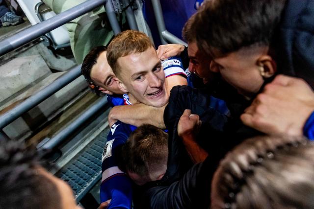 Slovakia's forward #08 Tomas Bobcek (C) celebrates scoring his team's first goal with team mates just before the end of the World Cup 2026 European Qualifiers football match between Slovakia and Northern Ireland on November 14, 2025 in Kosice, Slovakia. Slovakia won the match 1-0. (Photo by Branislav Racko / AFP)