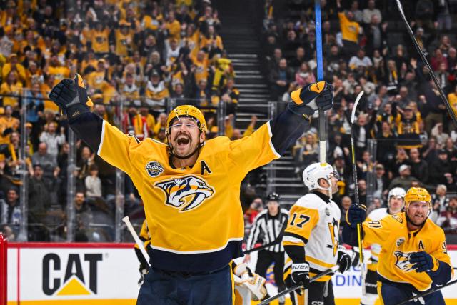 TOPSHOT - Nashville Predators' forward Filip Forsberg #09 and team mates celebrate after scoring the 1-1 goal during the NHL Global Series Ice Hockey match between Pittsburgh Penguins and Nashville Predators in Stockholm on November 14, 2025. Nashville Predators won the match 2-1. (Photo by Jonathan NACKSTRAND / AFP)