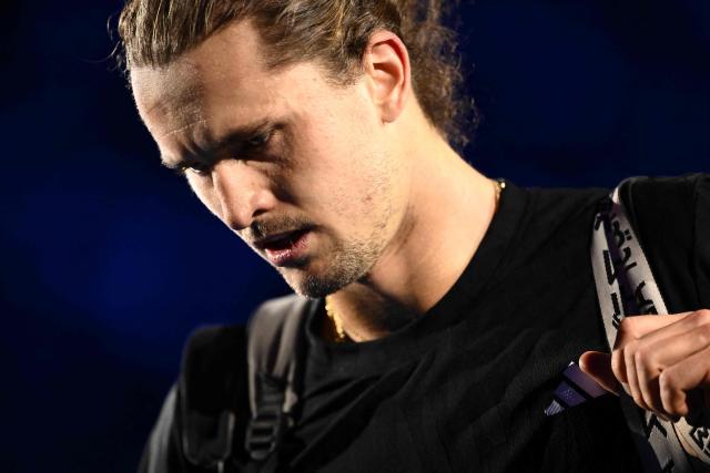 Germany's Alexander Zverev looks on after his men's single match against Canada's Felix Auger Aliassime at the ATP Finals tennis tournament, in Turin, on November 14, 2025. (Photo by MARCO BERTORELLO / AFP)