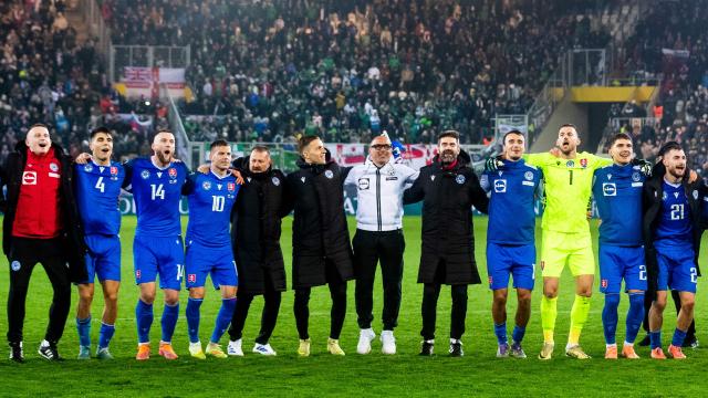 Slovakia's Italian head coach Francesco Calzona (6R) celebrates with his team and fans after the World Cup 2026 European Qualifiers football match between Slovakia and Northern Ireland on November 14, 2025 in Kosice, Slovakia. Slovakia won the match 1-0. (Photo by Branislav Racko / AFP)