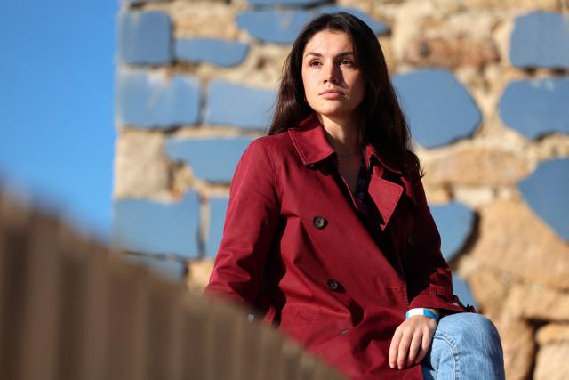 Corsican student Leria Maria Musso poses in AJaccio, on the French Mediterranean island of Corsica, on November 13, 2025. Syndicat agricole Via Campagnola (Confédération paysanne) has joined the anti-mafia coordination, created at the end of September 2025 and bringing together anti-mafia collectives, unions and environmental protection associations, which is calling for demonstrations on November 15, 2025 afternoon in Ajaccio and Bastia with the slogan "Assassins, mobsters, out!". (Photo by Pascal POCHARD-CASABIANCA / AFP)