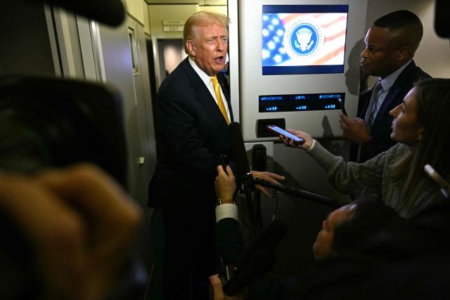 US President Donald Trump speaks to reporters aboard Air Force One en route to Palm Beach, Florida, on November 14, 2025. Trump is headed to his Mar-a-Lago, Florida, residence where he will spend the weekend. (Photo by Jim WATSON / AFP)