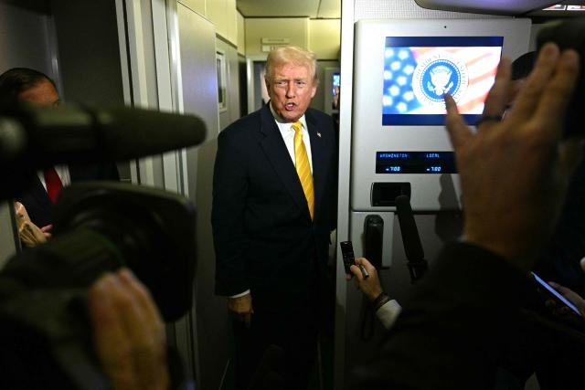 US President Donald Trump speaks to reporters aboard Air Force One en route to Palm Beach, Florida, on November 14, 2025. Trump is headed to his Mar-a-Lago, Florida, residence where he will spend the weekend. (Photo by Jim WATSON / AFP)
