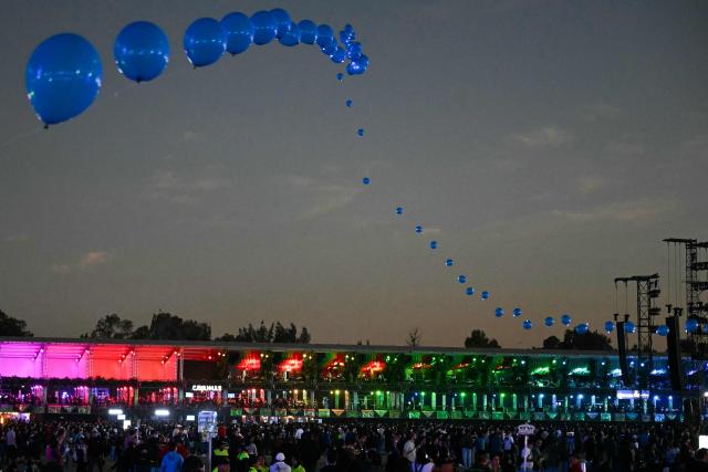 People attend the Corona Capital music festival in Mexico City on November 14, 2025. (Photo by Yuri CORTEZ / AFP)