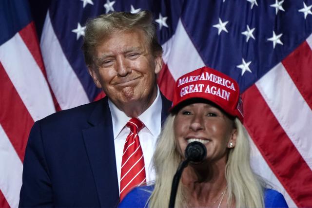 (FILES) US Representative Marjorie Taylor Greene (R) speaks alongside former US President and 2024 presidential hopeful Donald Trump at a campaign event in Rome, Georgia, on March 9, 2024. US President Donald Trump said on November 14, 2025 that he was pulling his endorsement for key ally Marjorie Taylor Greene after a string of disagreements, calling the hard-right lawmaker a "ranting lunatic." "I am withdrawing my support and Endorsement of 'Congresswoman' Marjorie Taylor Greene," Trump said on Truth Social. "All I see “Wacky” Marjorie do is COMPLAIN, COMPLAIN, COMPLAIN!" (Photo by Elijah Nouvelage / AFP)