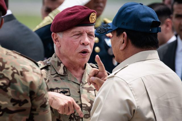 Jordan's King Abdullah II (L) speaks with Indonesia’s President Prabowo Subianto before his departure at Halim Perdanakusuma Air Force Base in Jakarta on November 15, 2025. (Photo by YASUYOSHI CHIBA / AFP)