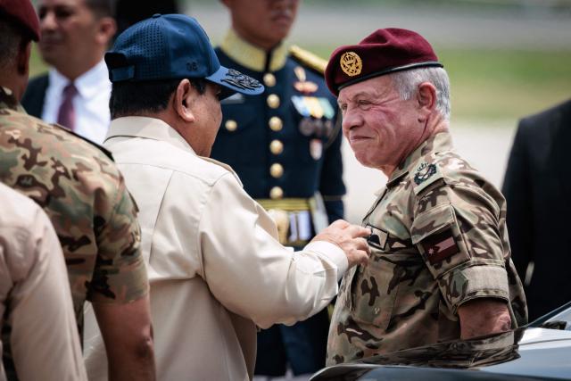 Jordan's King Abdullah II (R) speaks with Indonesia’s President Prabowo Subianto before his departure at Halim Perdanakusuma Air Force Base in Jakarta on November 15, 2025. (Photo by YASUYOSHI CHIBA / AFP)